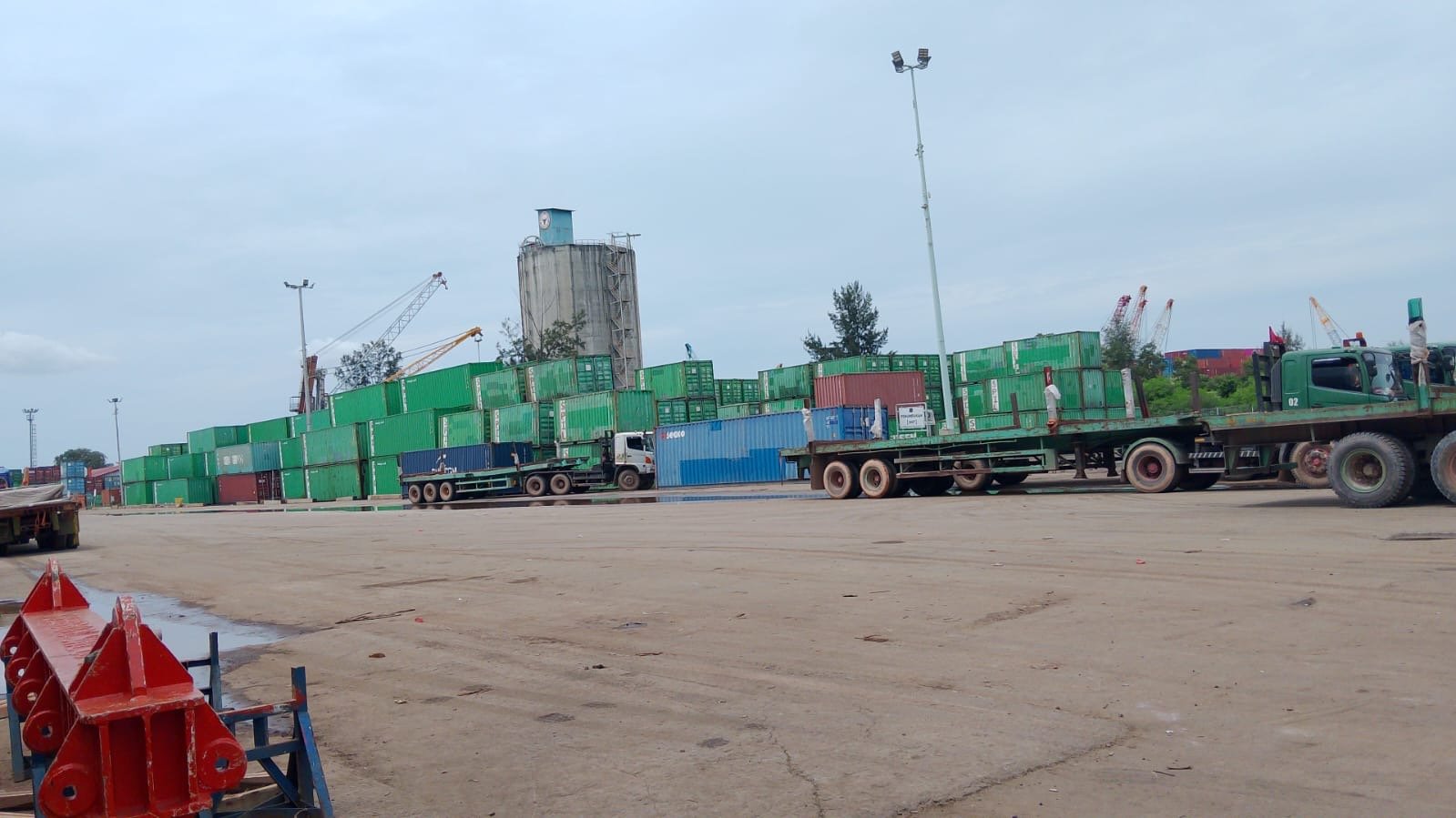 Flatbed trailers lining up at the port in Batam